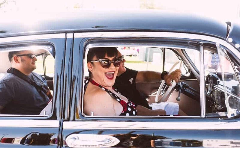 Pin-up Girl Riding with Two men in classic car Route 66 Cruisin'' Reunion