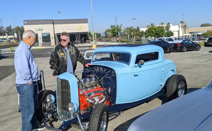 Two men admire hot rod at Heights Cruizers Cars & Coffee